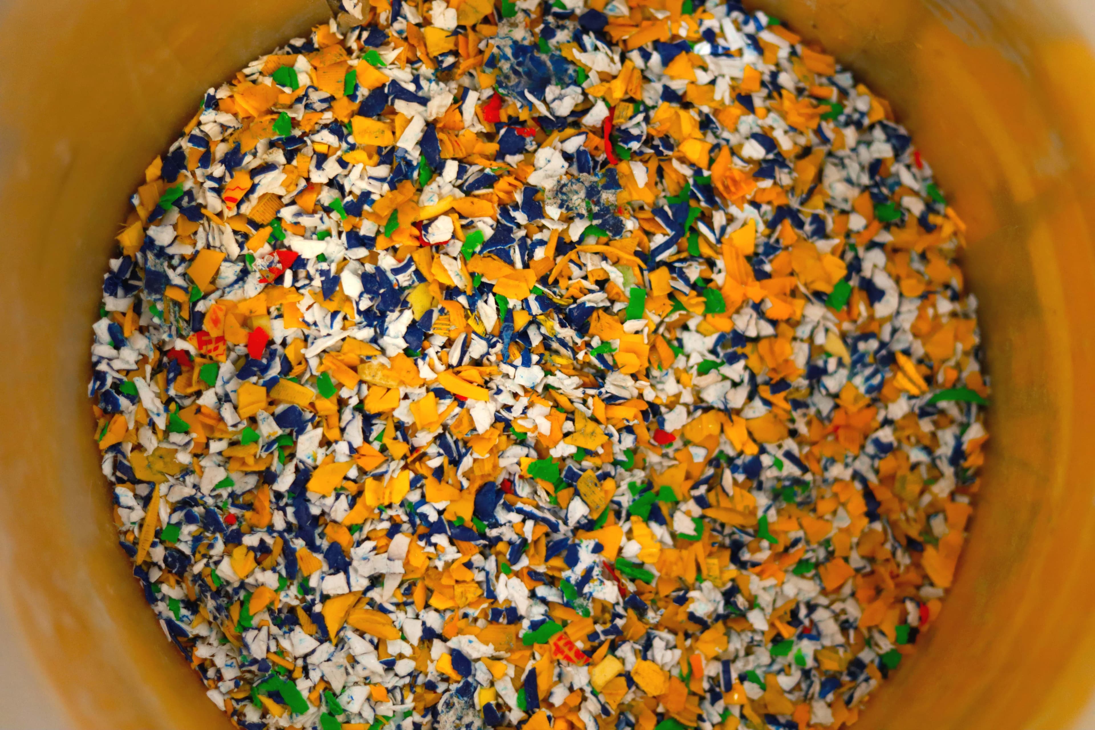 WE SHRED INTO FLAKES THEN REFORM NEW MATERIAL